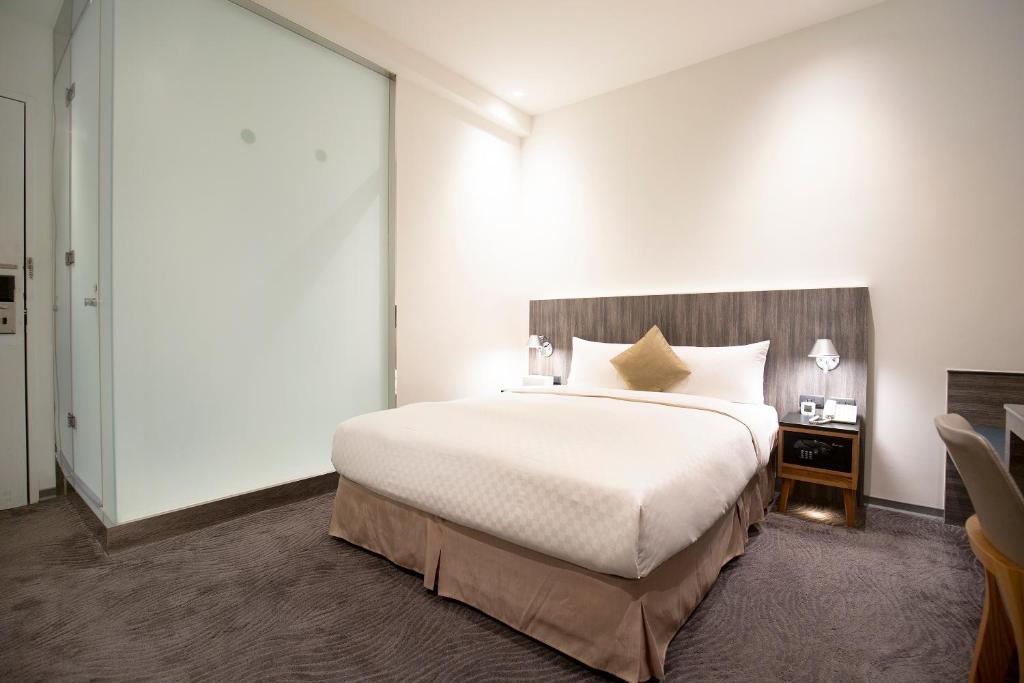 Postel nebo postele na pokoji v ubytování Dandy Hotel - Tianjin Branch