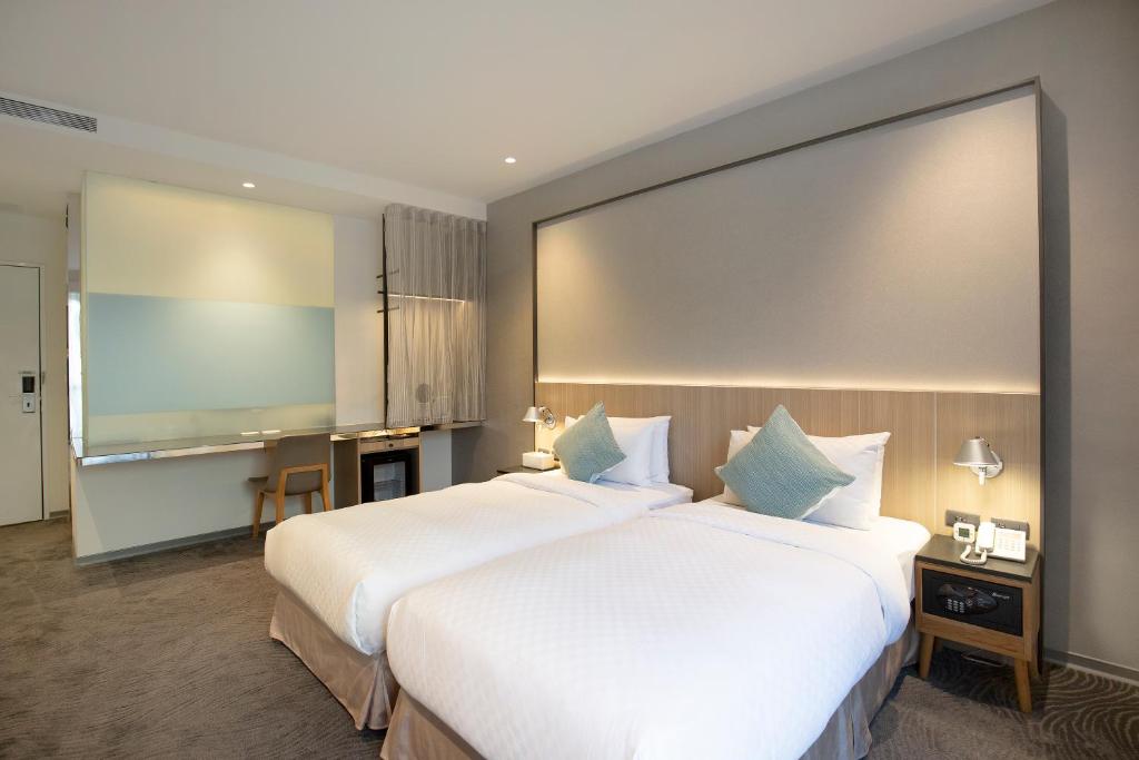 Postel nebo postele na pokoji v ubytování Dandy Hotel - Tianjin Branch