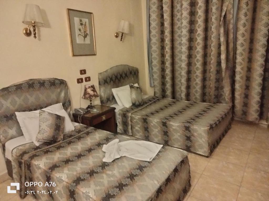 Postel nebo postele na pokoji v ubytování Anubis Hostel