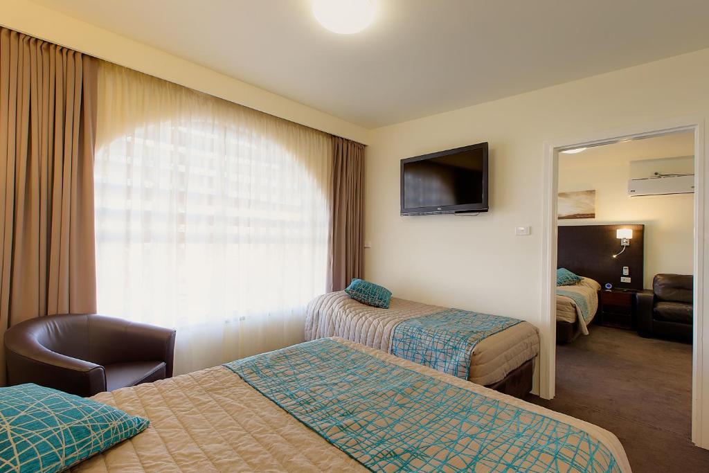 Postel nebo postele na pokoji v ubytování El Motor Inn