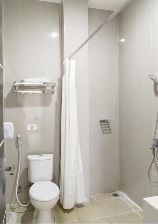 Koupelna v ubytování KHARIZ HOTEL