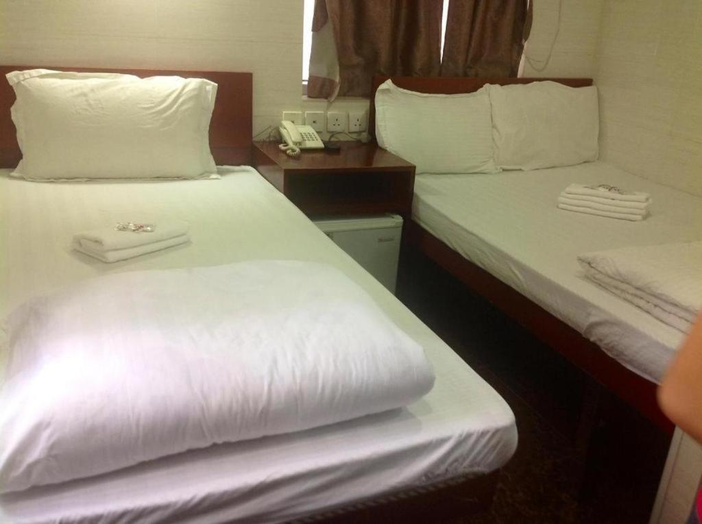 Postel nebo postele na pokoji v ubytování New Fortunate Guest House A1
