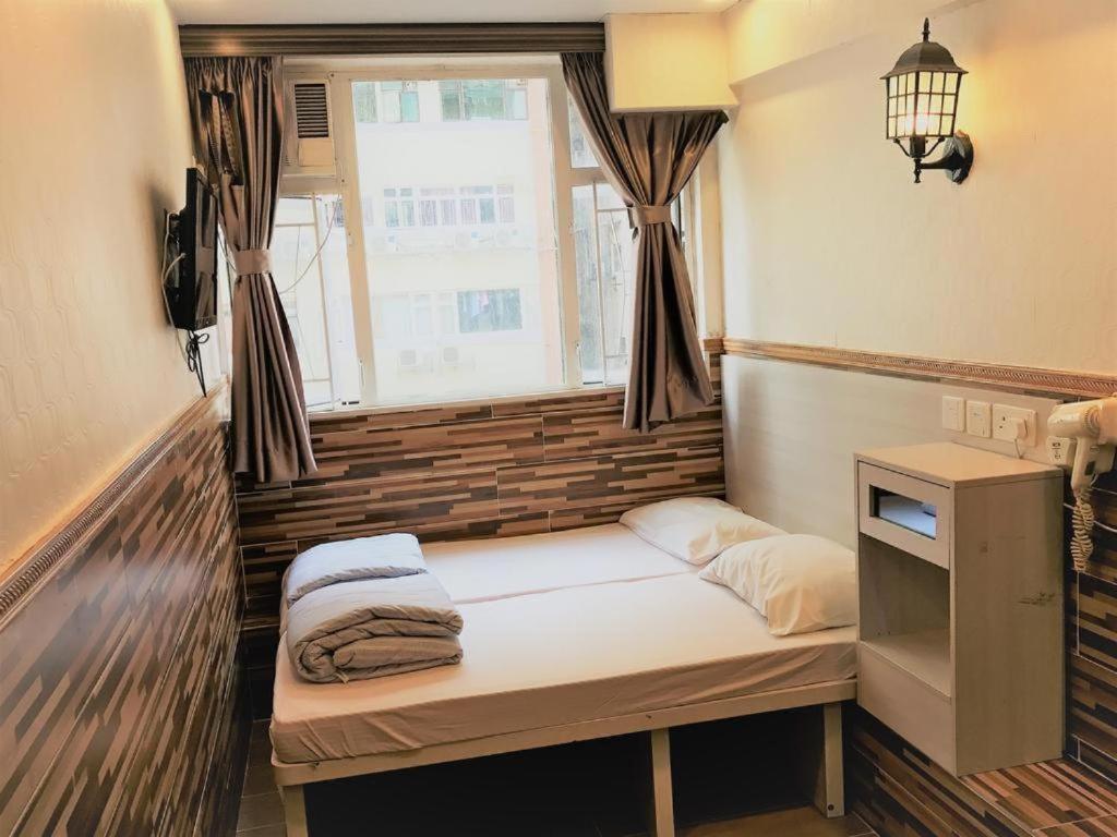 Postel nebo postele na pokoji v ubytování New Fortunate Guest House A1
