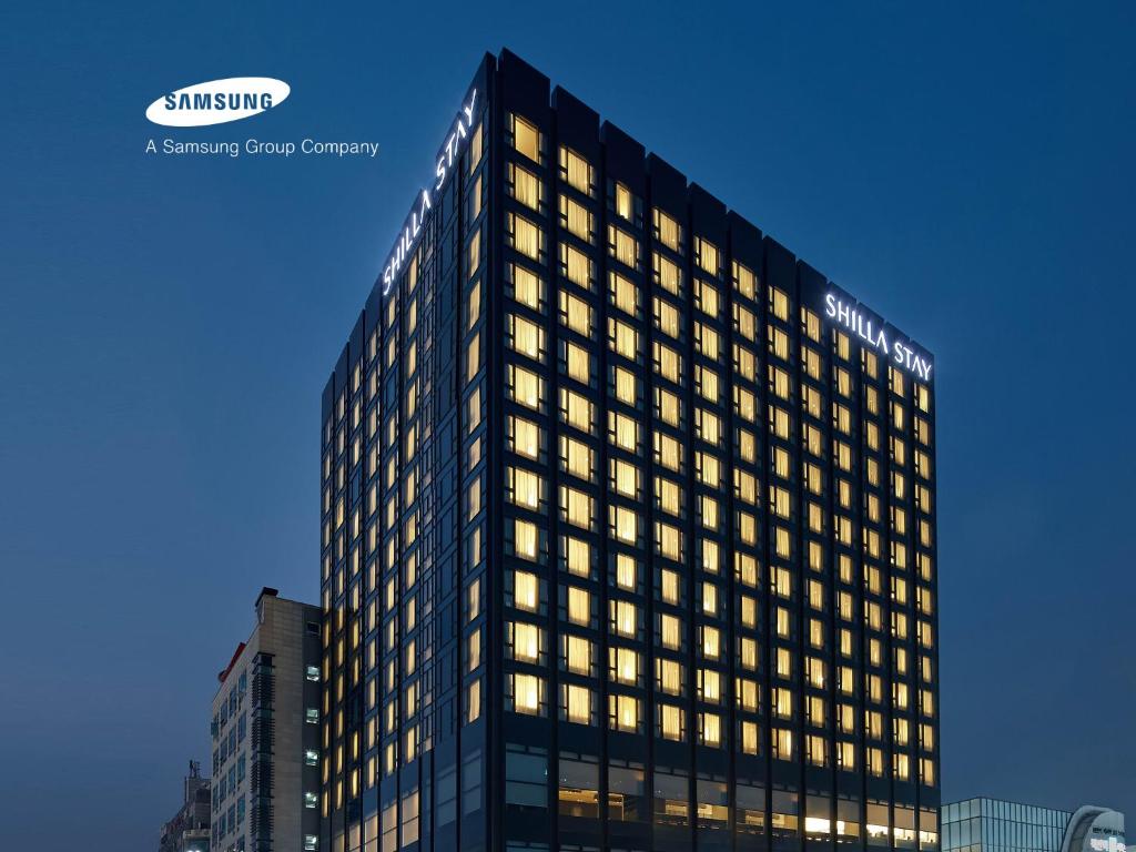 a tall black building with many windows at Shilla Stay Cheonan in Cheonan