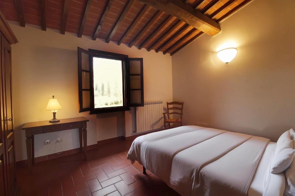 Postel nebo postele na pokoji v ubytování Corte Tommasi Residence