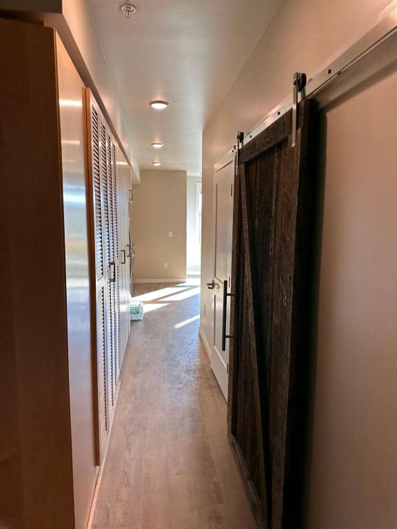 a hallway with wooden doors in a house at Entire 1-Bedroom Apartment In Downtown Portland in Portland
