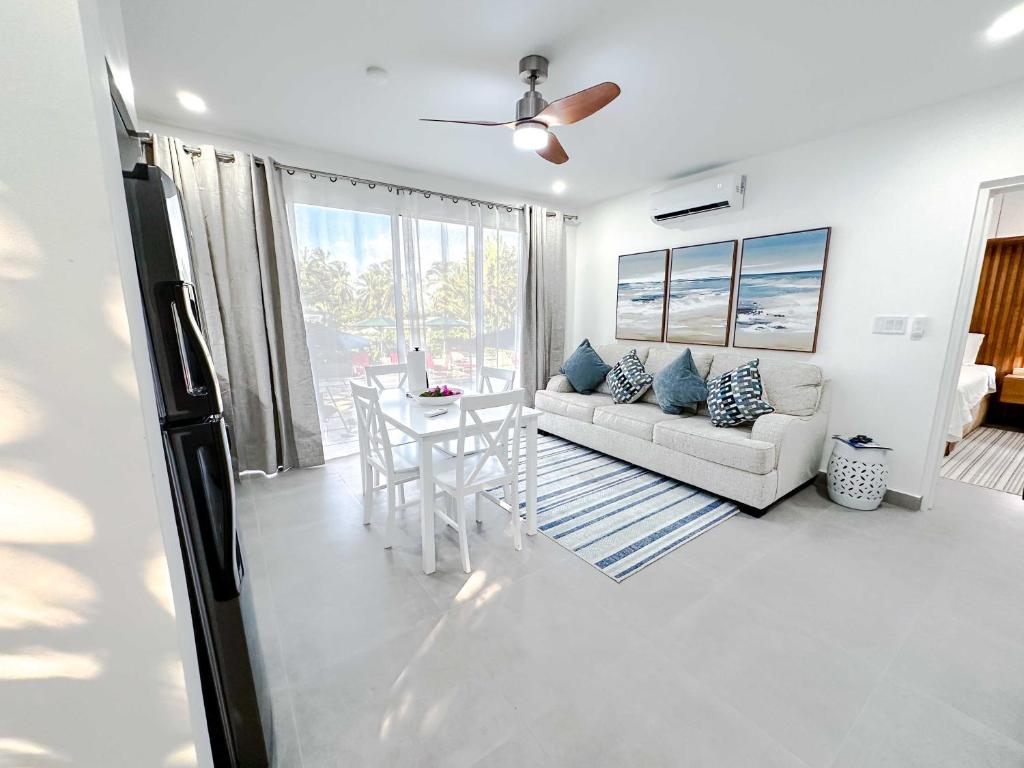 a living room with a couch and a table at The Palms Resort in Saint James