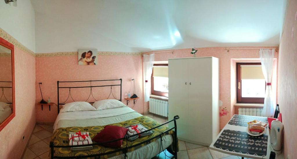 Łóżko lub łóżka w pokoju w obiekcie B&B Brunamonti