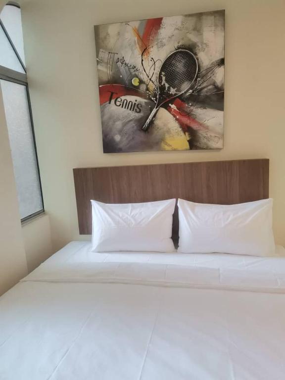 Postel nebo postele na pokoji v ubytování SCC Hotel Chinatown