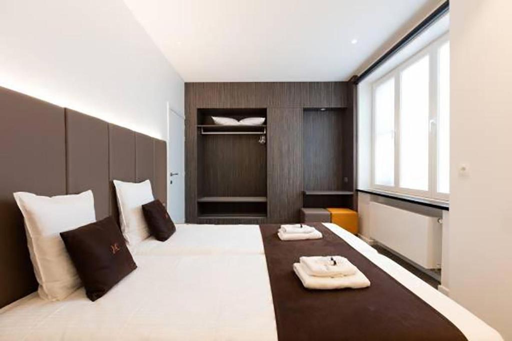 Postel nebo postele na pokoji v ubytování Hotel Central