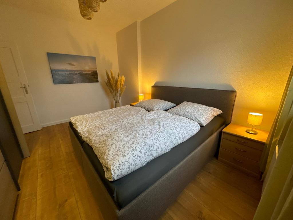 a bedroom with a bed with two pillows on it at Willkommen in Crossen 