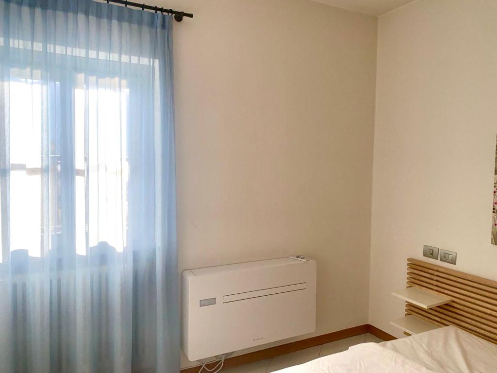 Postel nebo postele na pokoji v ubytování Regina lago di Como