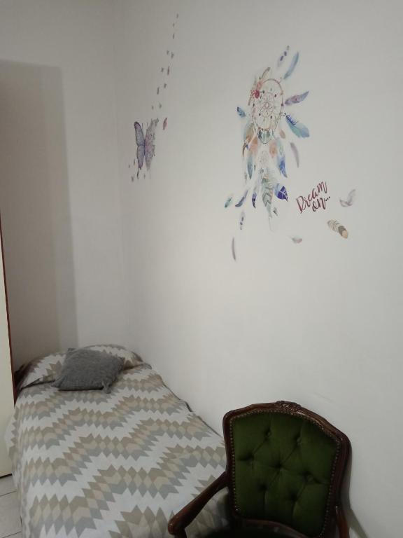 Postel nebo postele na pokoji v ubytování Nomentum House