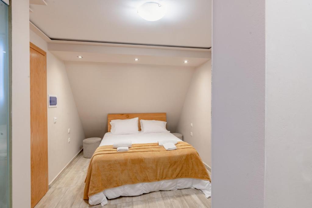 Postel nebo postele na pokoji v ubytování Zama Suites