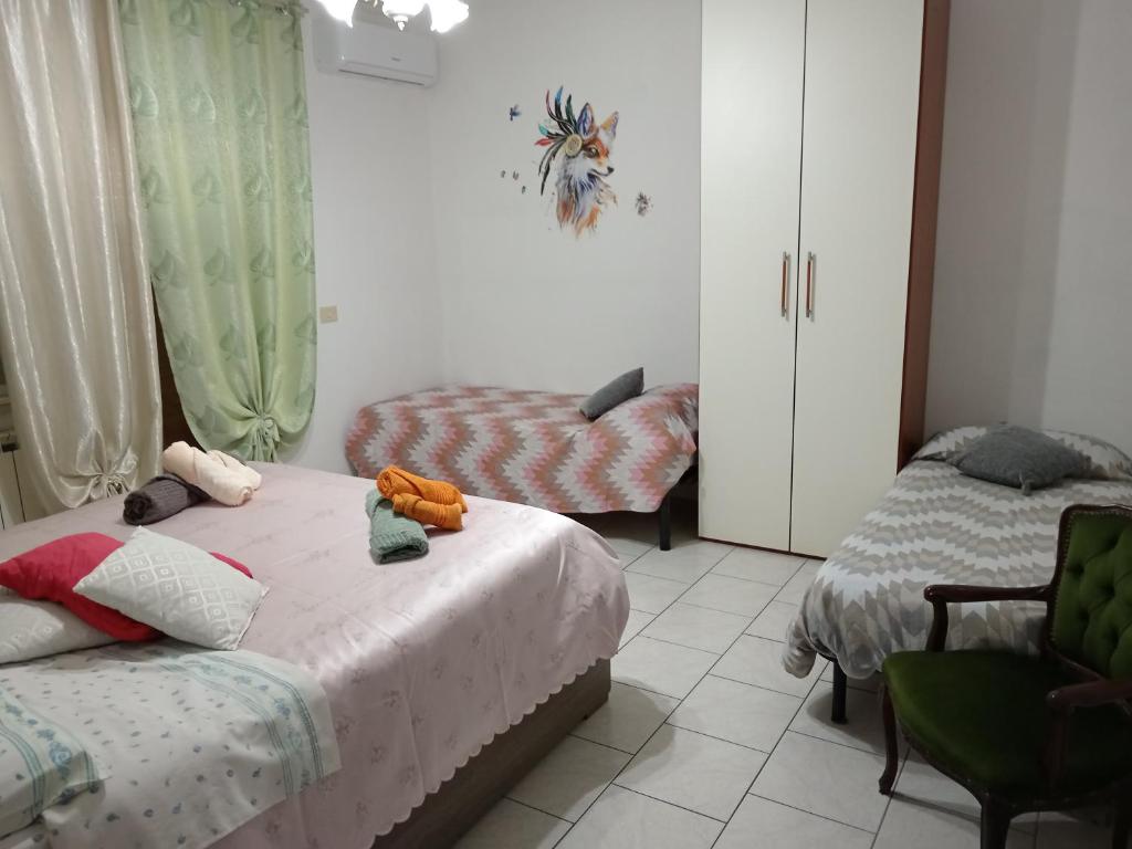 Postel nebo postele na pokoji v ubytování Nomentum House