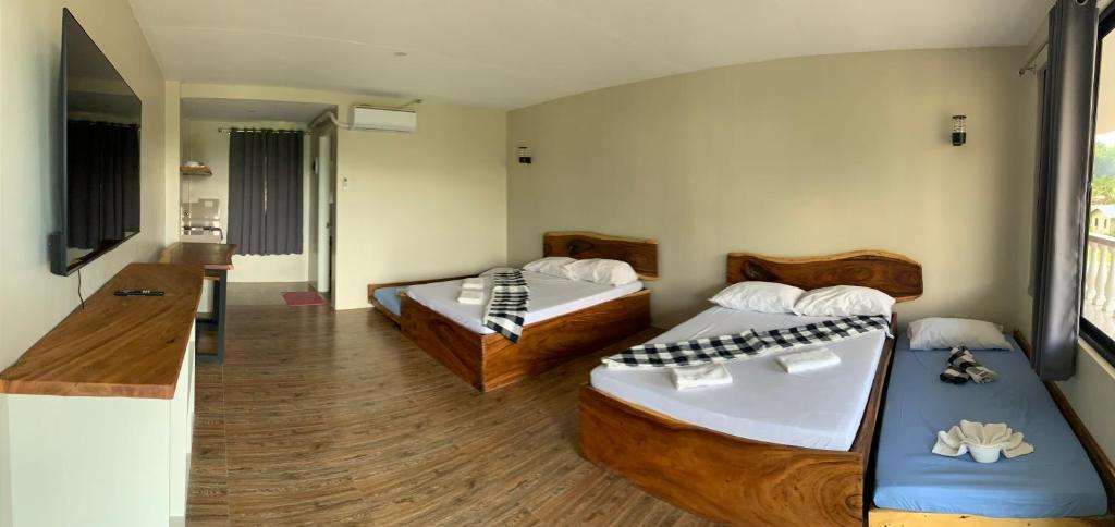 Postel nebo postele na pokoji v ubytování Lone Star Inn