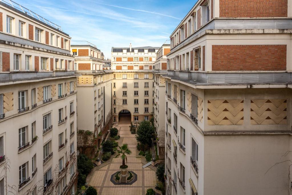 an aerial view of a city with buildings at The Carla Suite Eiffel Tower View in Paris