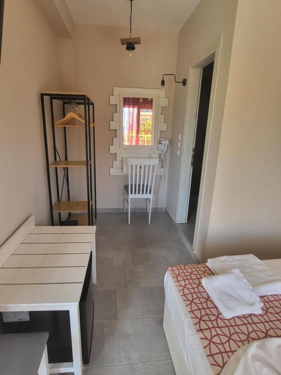 A bed or beds in a room at Agali Hotel
