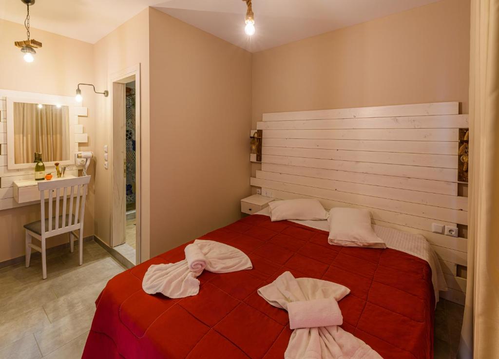 A bed or beds in a room at Agali Hotel