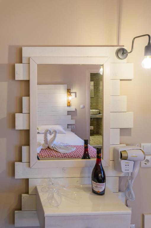 A bed or beds in a room at Agali Hotel