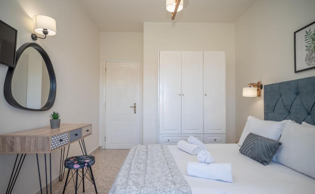 Postel nebo postele na pokoji v ubytování Kamara Apartments