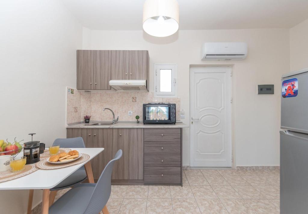 Kuchyň nebo kuchyňský kout v ubytování Kamara Apartments