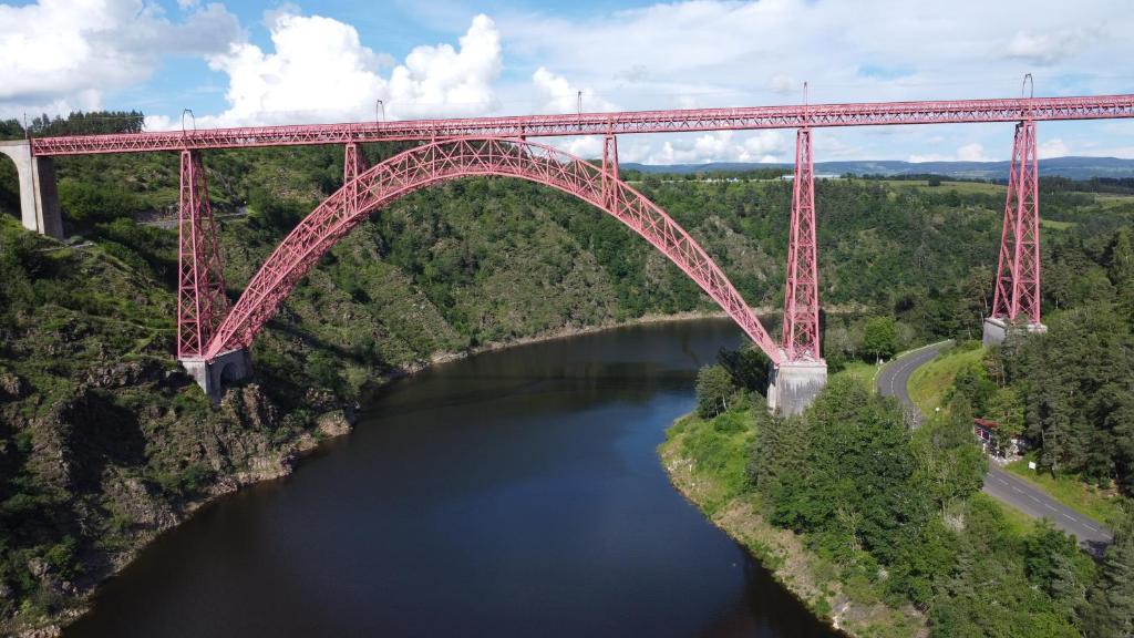 an overhead view of a bridge over a river at Logis Hôtel Beau Site in Loubaresse