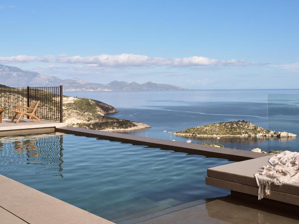 a swimming pool with a view of the ocean at Verdante Villas , Quintessential SeaView Living, By ThinkVilla in Agios Nikolaos