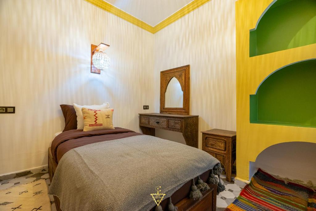 Postel nebo postele na pokoji v ubytování Riad Village