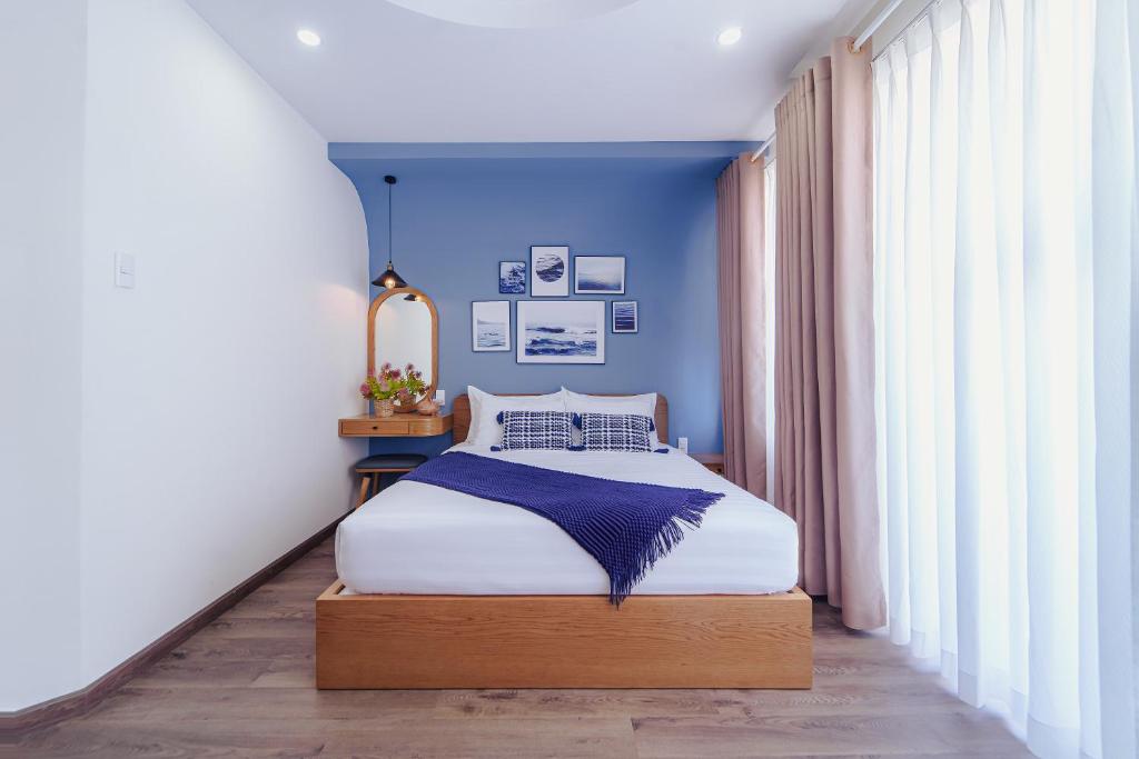Postel nebo postele na pokoji v ubytování Phuc Lam Hotel & Apartment
