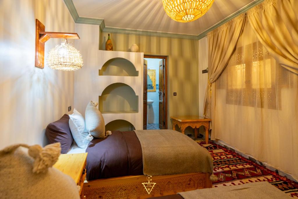 Postel nebo postele na pokoji v ubytování Riad Village