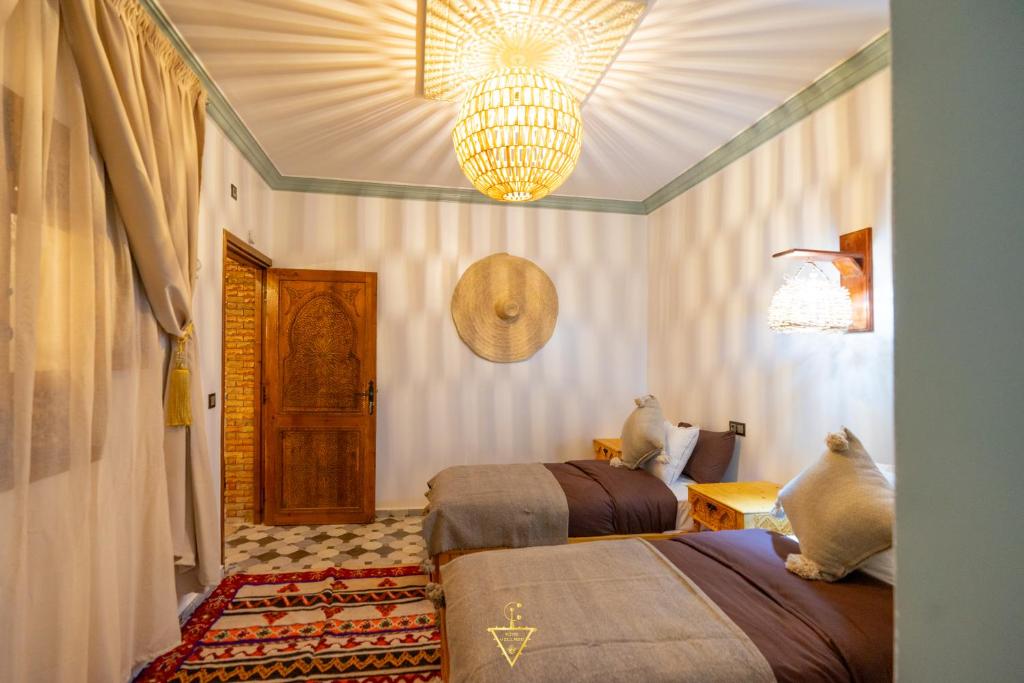 Postel nebo postele na pokoji v ubytování Riad Village