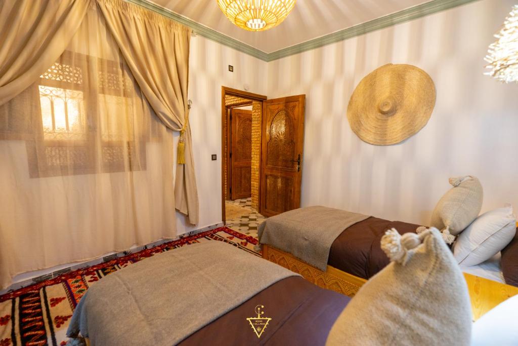 Postel nebo postele na pokoji v ubytování Riad Village