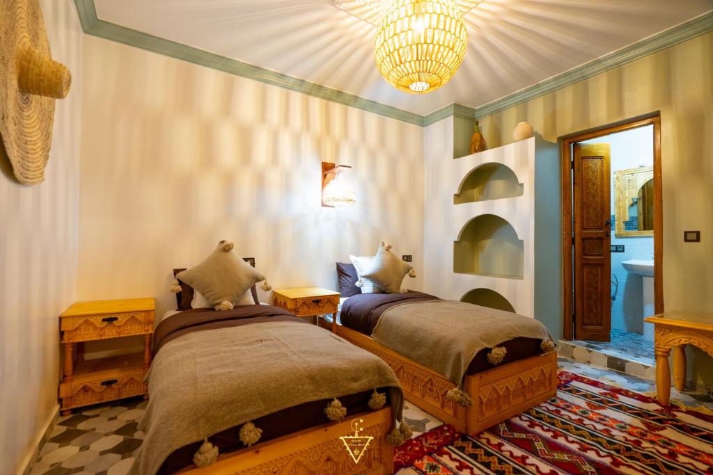 Postel nebo postele na pokoji v ubytování Riad Village