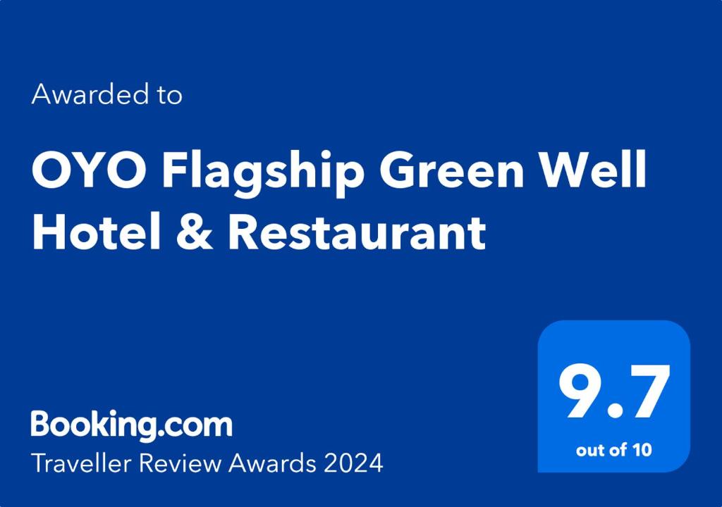 un panneau bleu qui indique l'oxo pavillon bien vert hôtel et restaurant dans l'établissement OYO Flagship Green Well Hotel & Restaurant, à Rewāri
