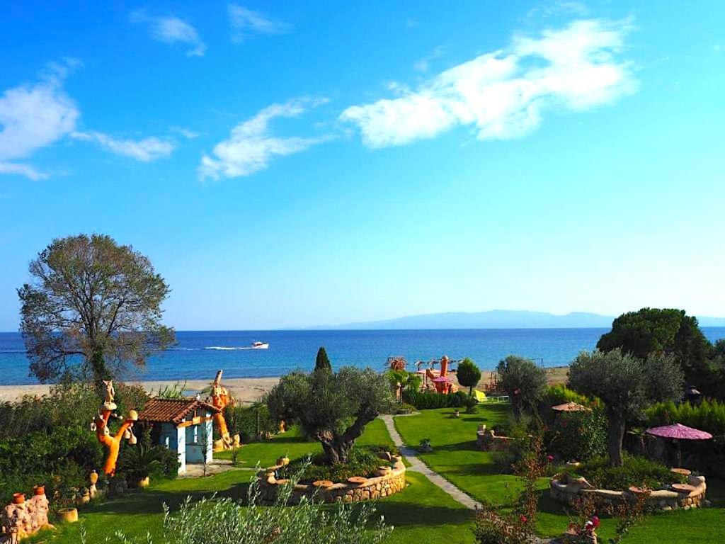 a view of a park with the ocean in the background at Medusa Gorgon in Develíkia