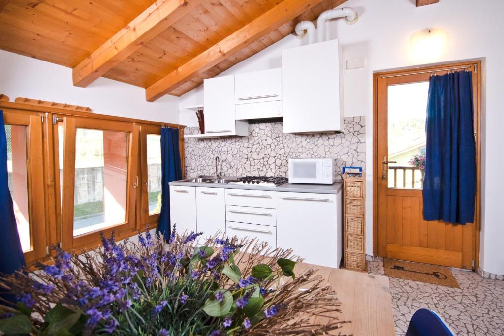 Kuchyň nebo kuchyňský kout v ubytování Hotel Martinelli