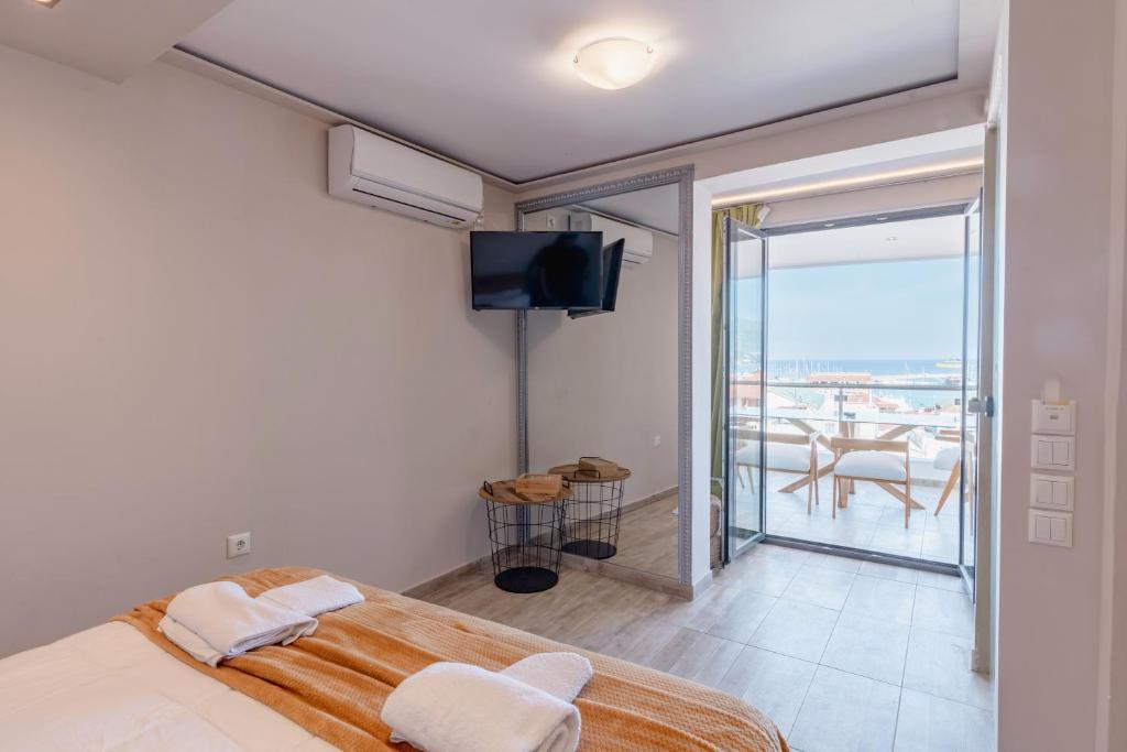 Postel nebo postele na pokoji v ubytování Zama Suites