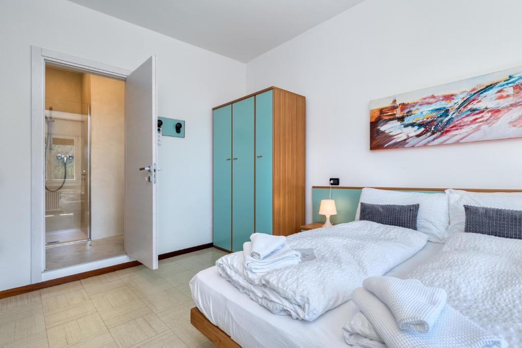 Postel nebo postele na pokoji v ubytování Hotel Martinelli