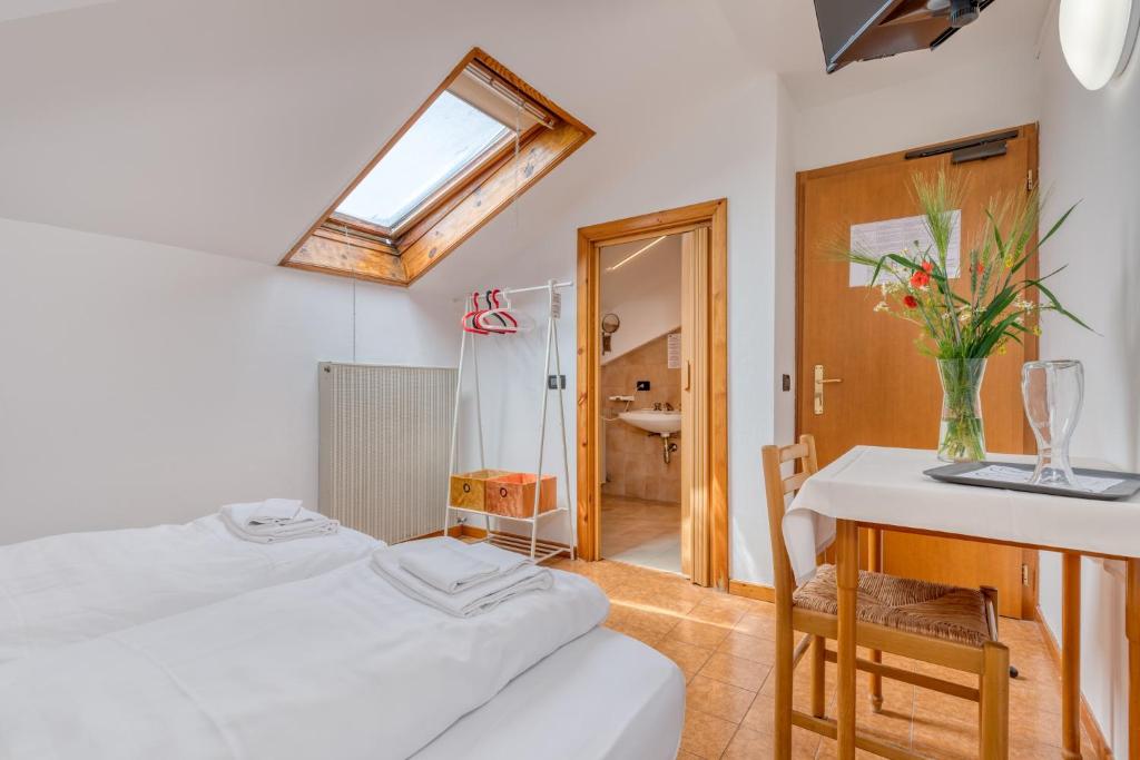Postel nebo postele na pokoji v ubytování Hotel Martinelli