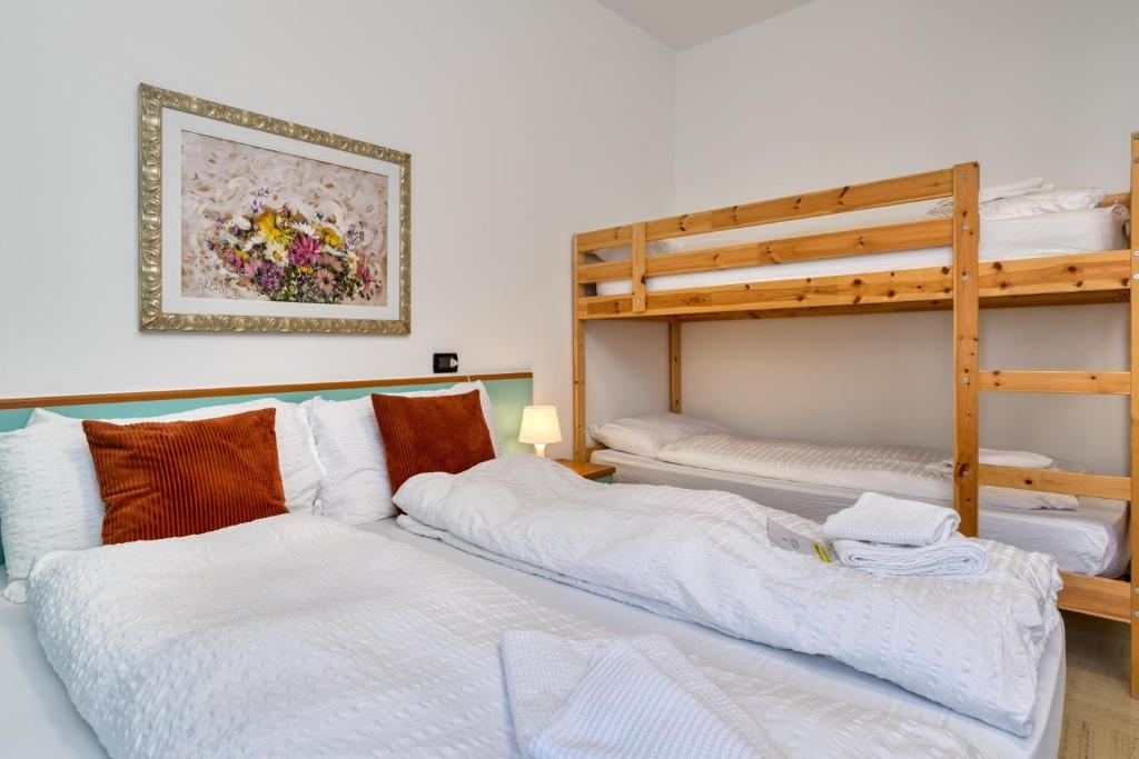 Postel nebo postele na pokoji v ubytování Hotel Martinelli