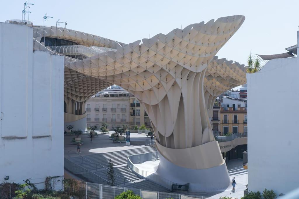 a large sculpture of a fish in a city at Apartamento junto a las Setas de Sevilla in Seville