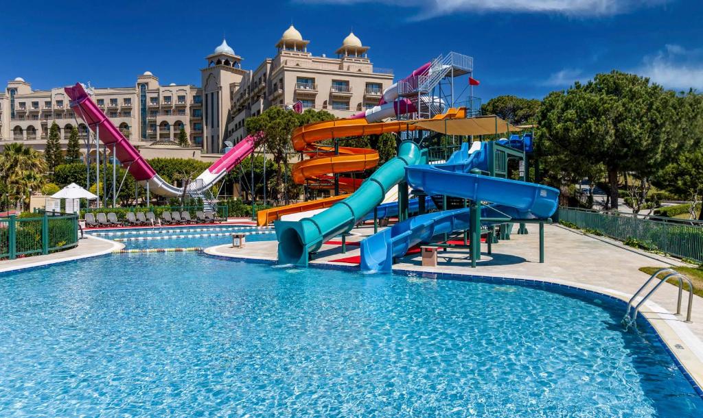 a water slide in a pool at a resort at Spice Hotel & Spa - Ultra All Inclusive in Belek