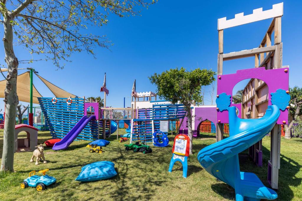 a playground with slides and play equipment in a park at Spice Hotel & Spa - Ultra All Inclusive in Belek