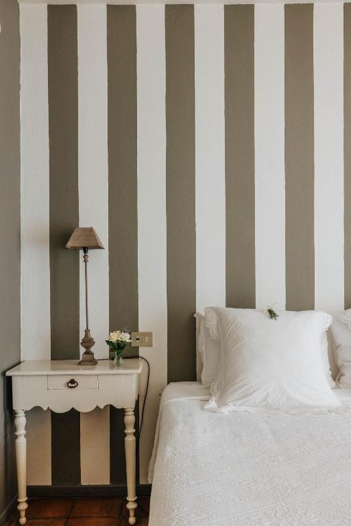 Postel nebo postele na pokoji v ubytování Apricus Locanda Boutique Hotel