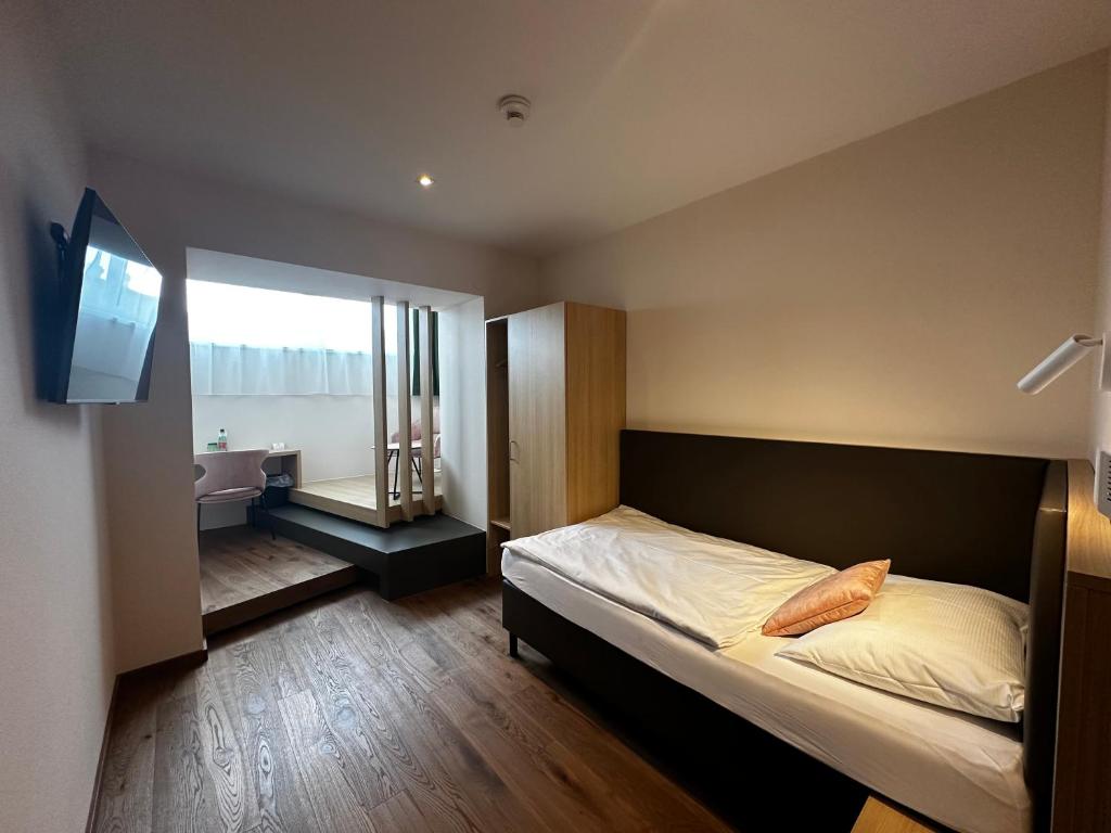 Posteľ alebo postele v izbe v ubytovaní Hotel-Gasthof Graf