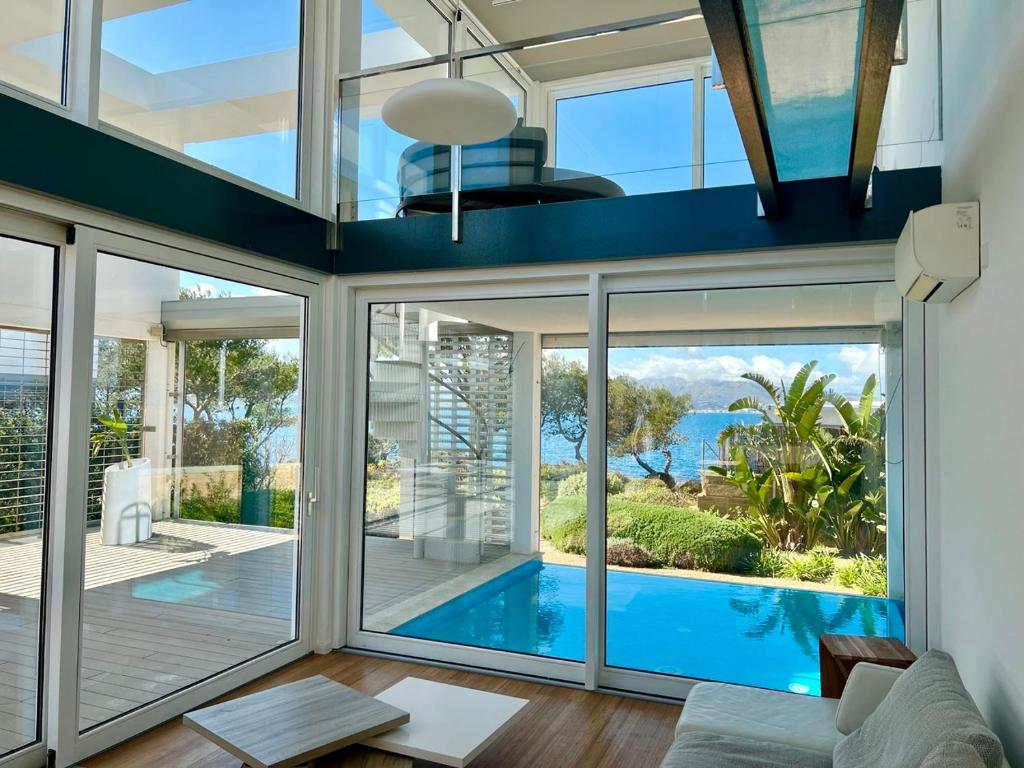 an open living room with a view of a swimming pool at Miramar 9 Manresa in Alcudia