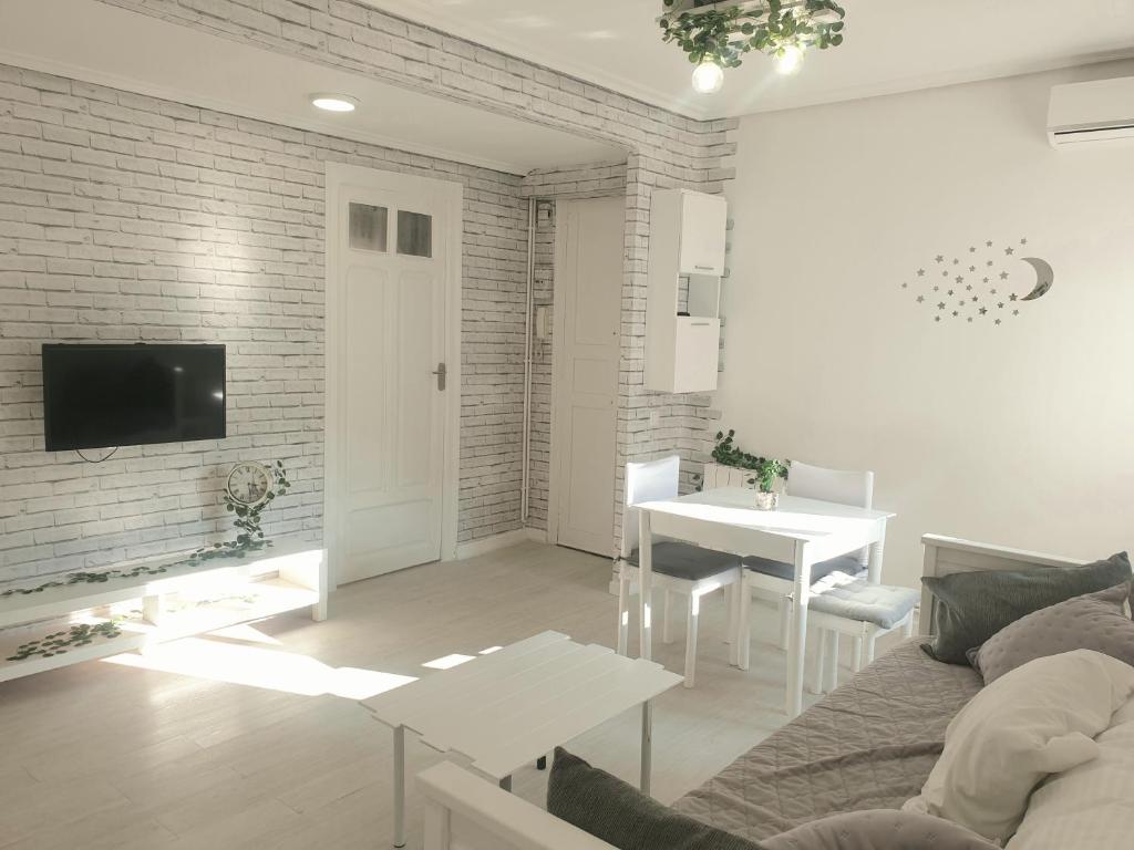 a living room with a couch and a table at Apartamento Eguzkilore. Logroño in Logroño