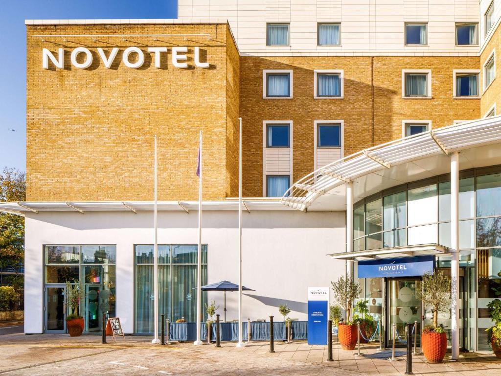 a novoiced hotel in front of a building at Novotel London Greenwich in London