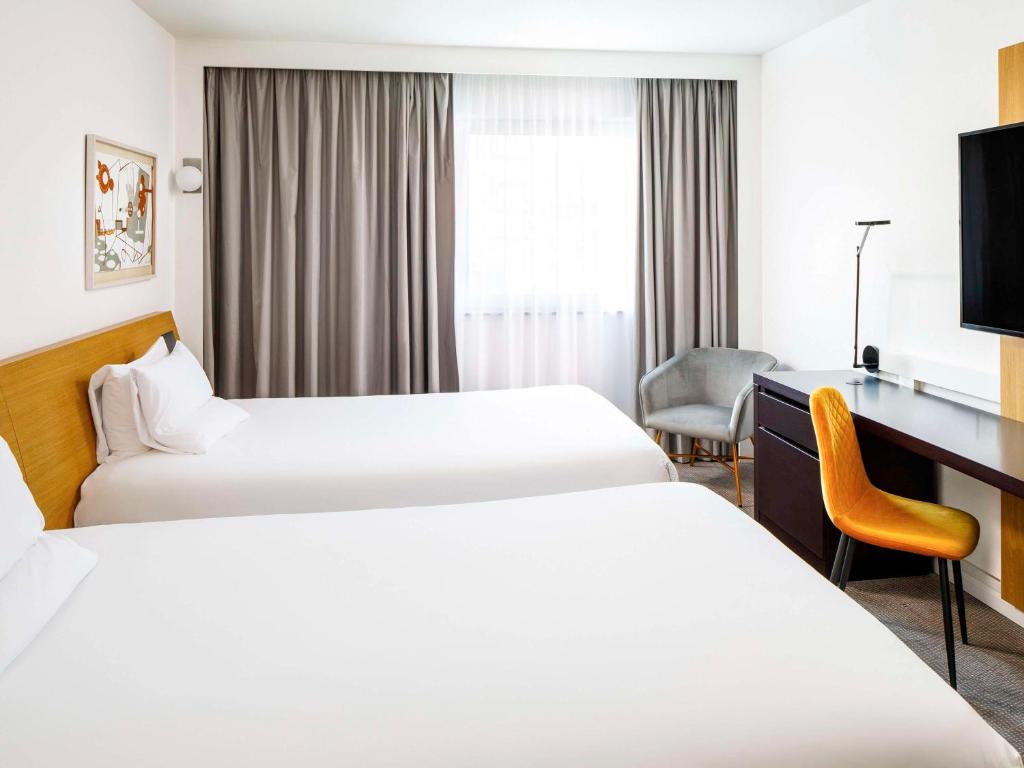 Postel nebo postele na pokoji v ubytování Novotel London Greenwich